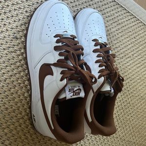 Nike Air Force 1 sneakers. Very unique white with brown.have scuff on back right